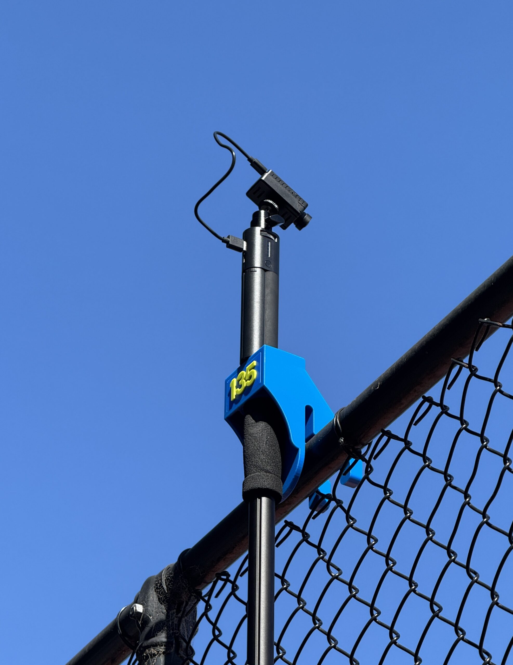 135 Capture camera mount on tennis fence