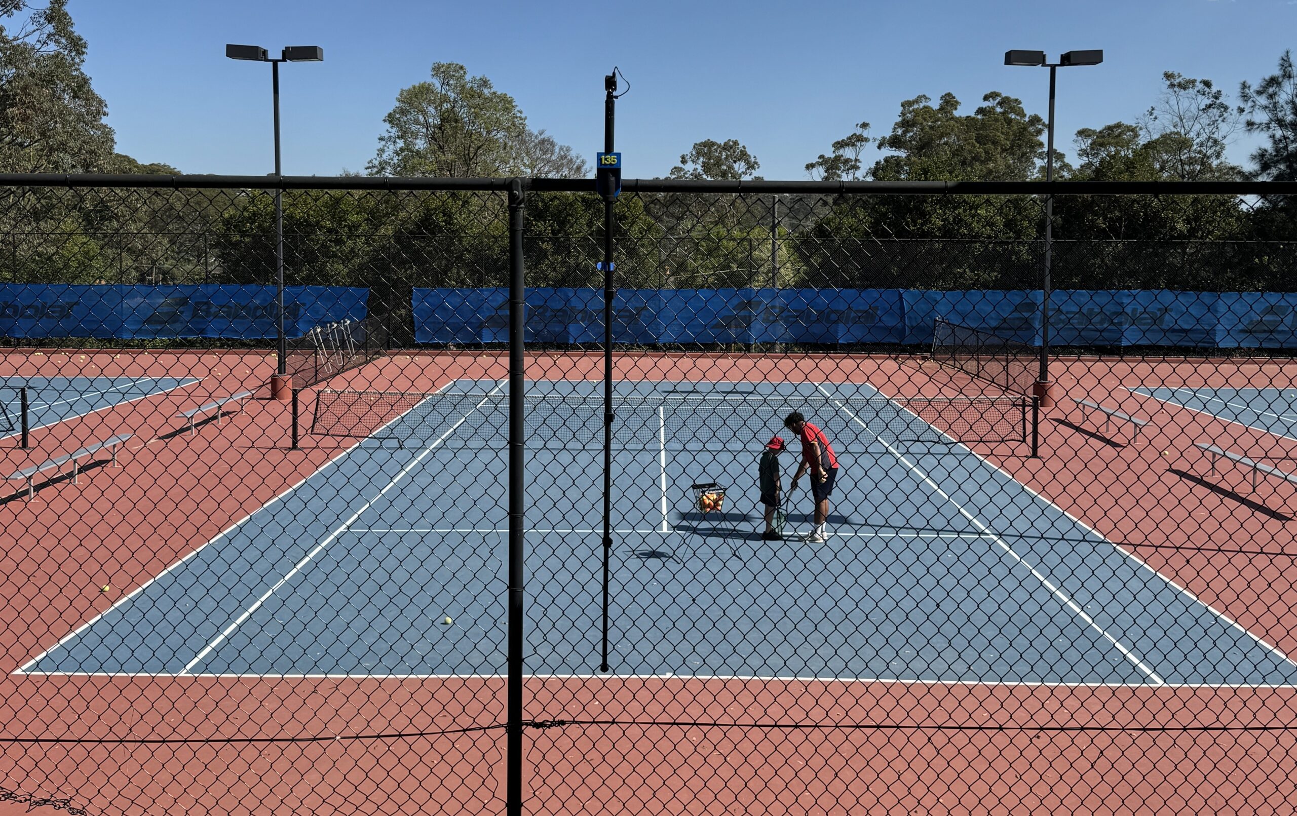 135 Capture recording tennis court from back fence